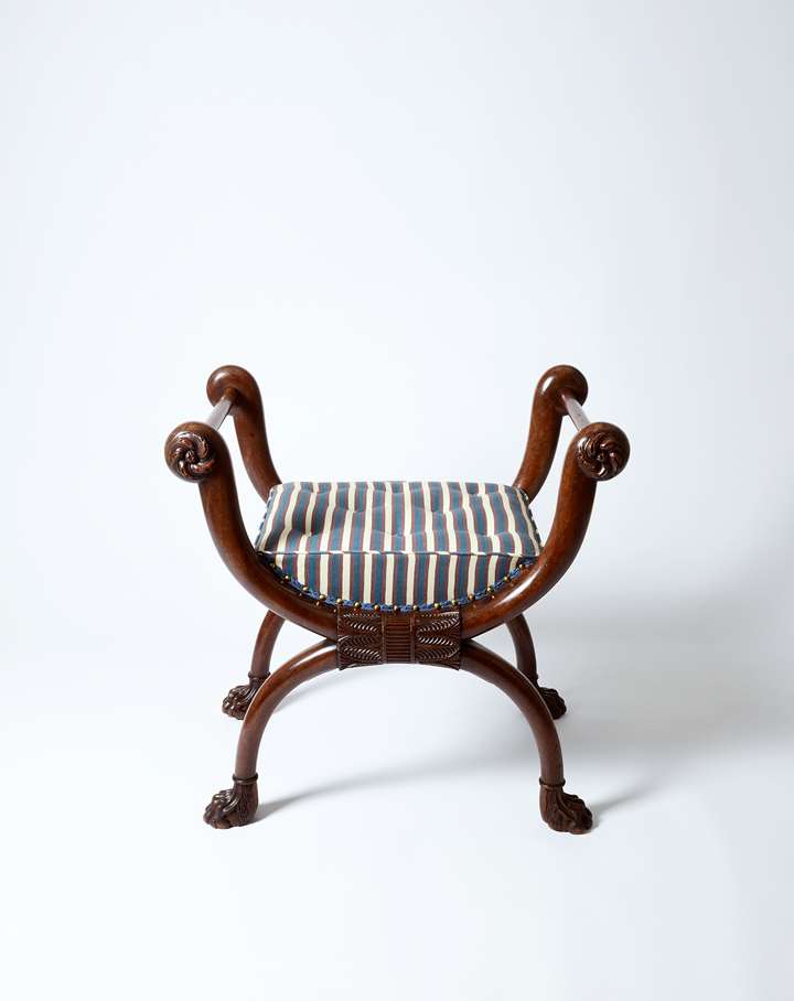 A fine carved mahogany stool